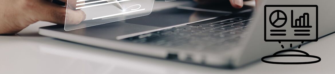 Technical documentation and workflow diagrams on a laptop